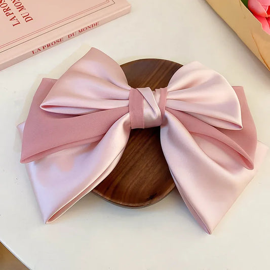 The Colette Bow Clip — blush pink soft bow hair clip in a gilded barrette