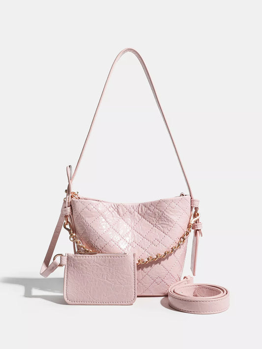 The Séraphine Bucket Bag — pink structured bucket bag with adjustable strap